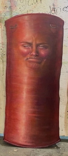 red punching bag with a woman's face