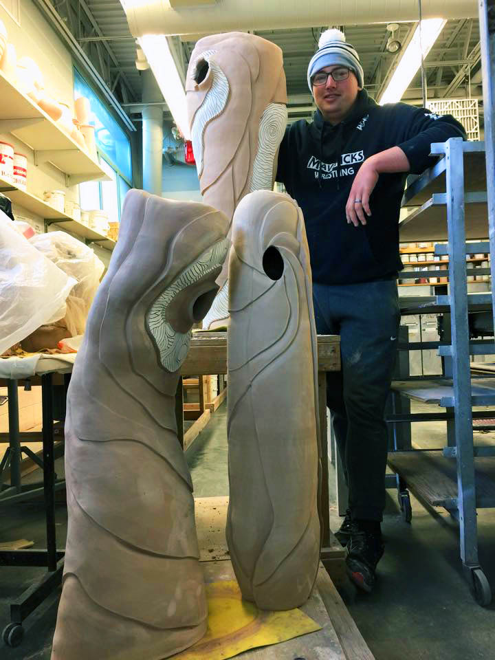  Caleb Brown working on his sculptures