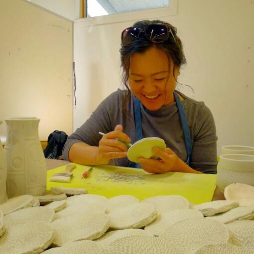 Professor KyoungHwa Oh working on pots