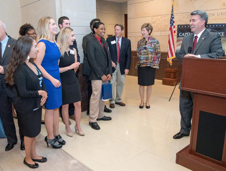 Students and speaker conversing