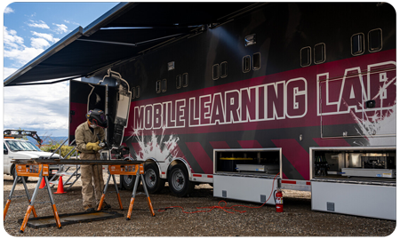 Welder using the mobile learning lab