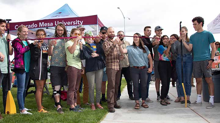 OP Director Ryan Dutch and his staff helped cut the ribbon at the grand opening