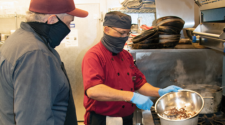 Jose Velez learns the finer points of melting chocolate from executive chef Kenneth Kinser