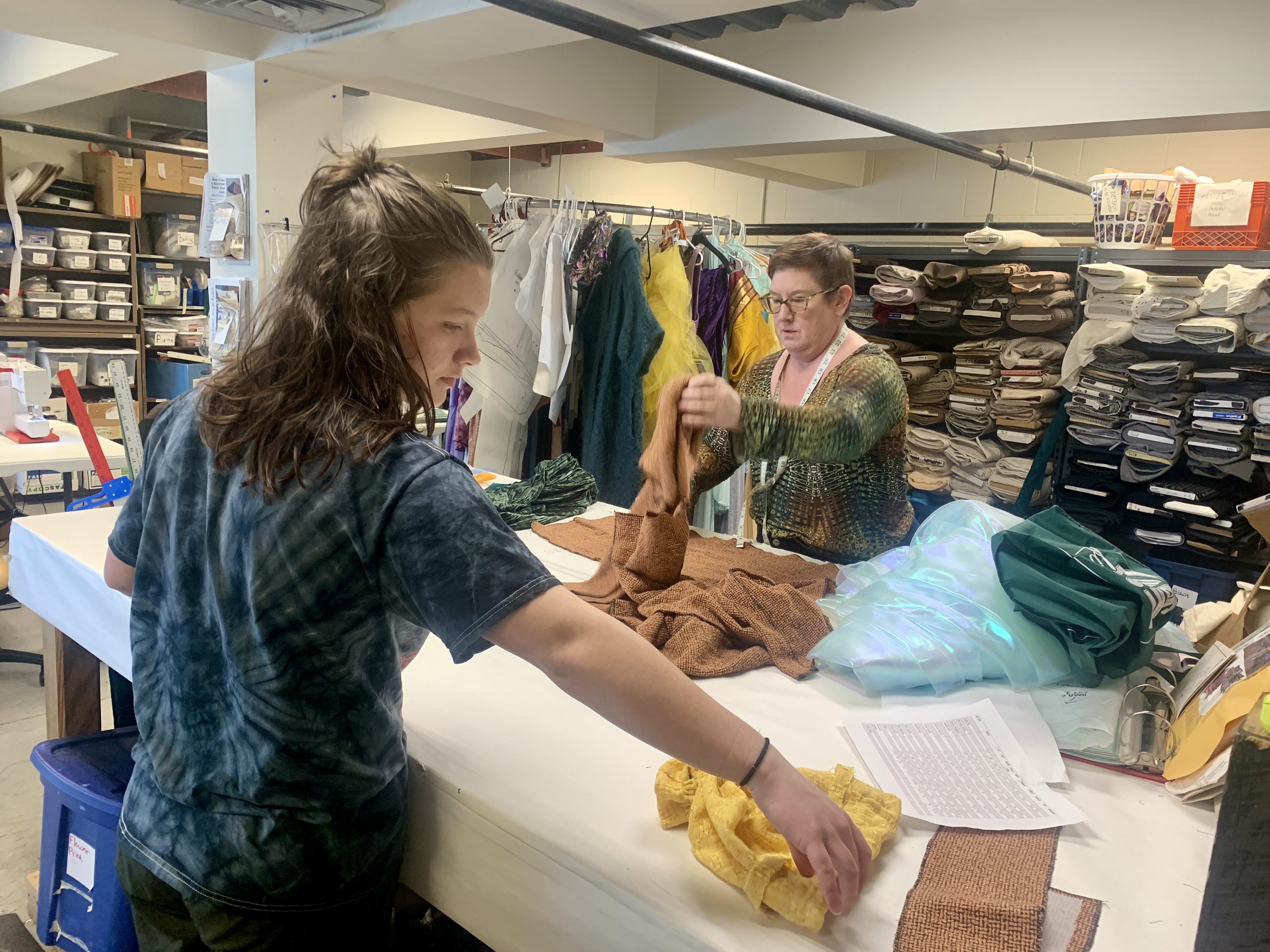 Jill Van Brussel and costume shop workers