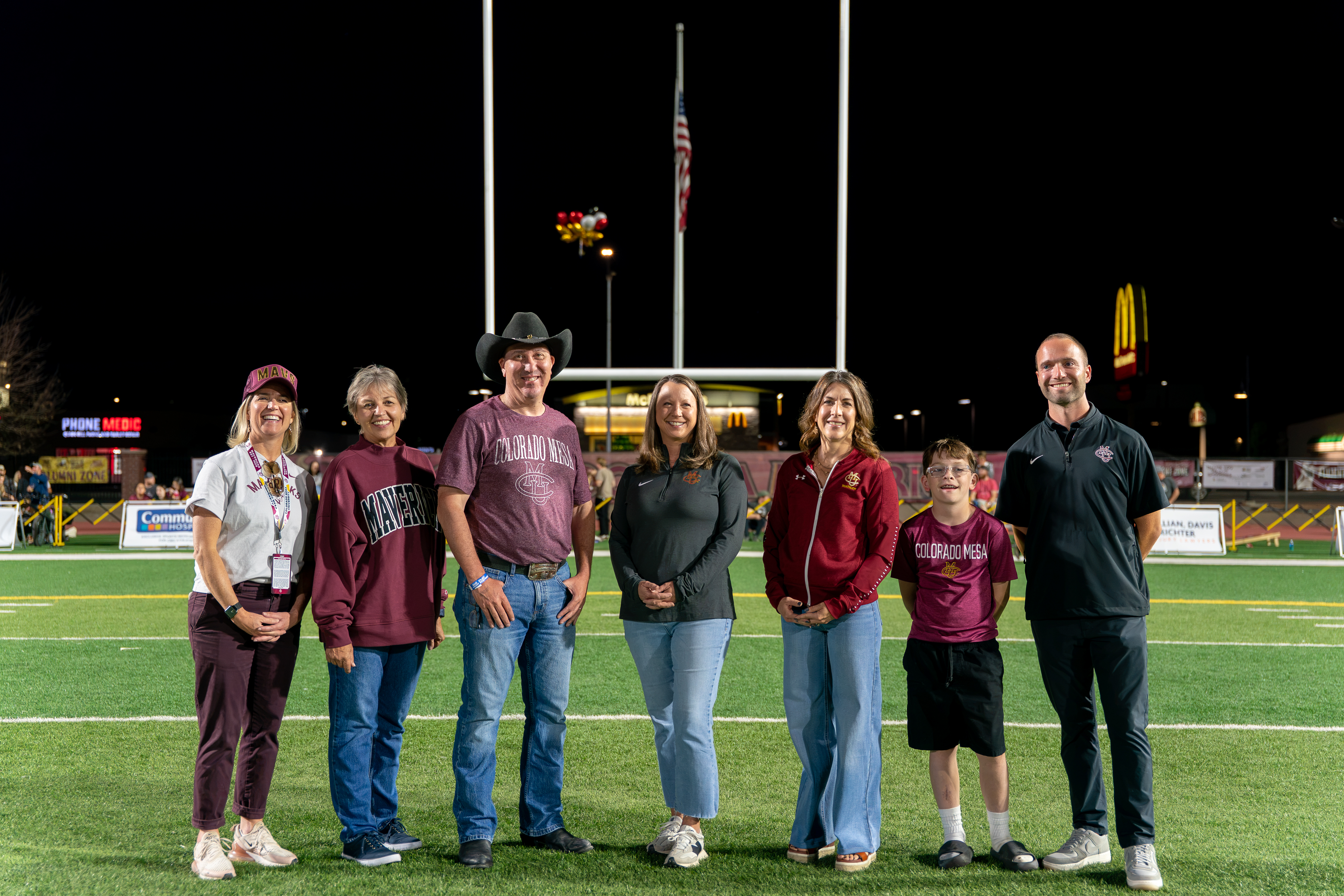 Community Hospital and CMU representatives during the halftime announcement of the video board addition.
