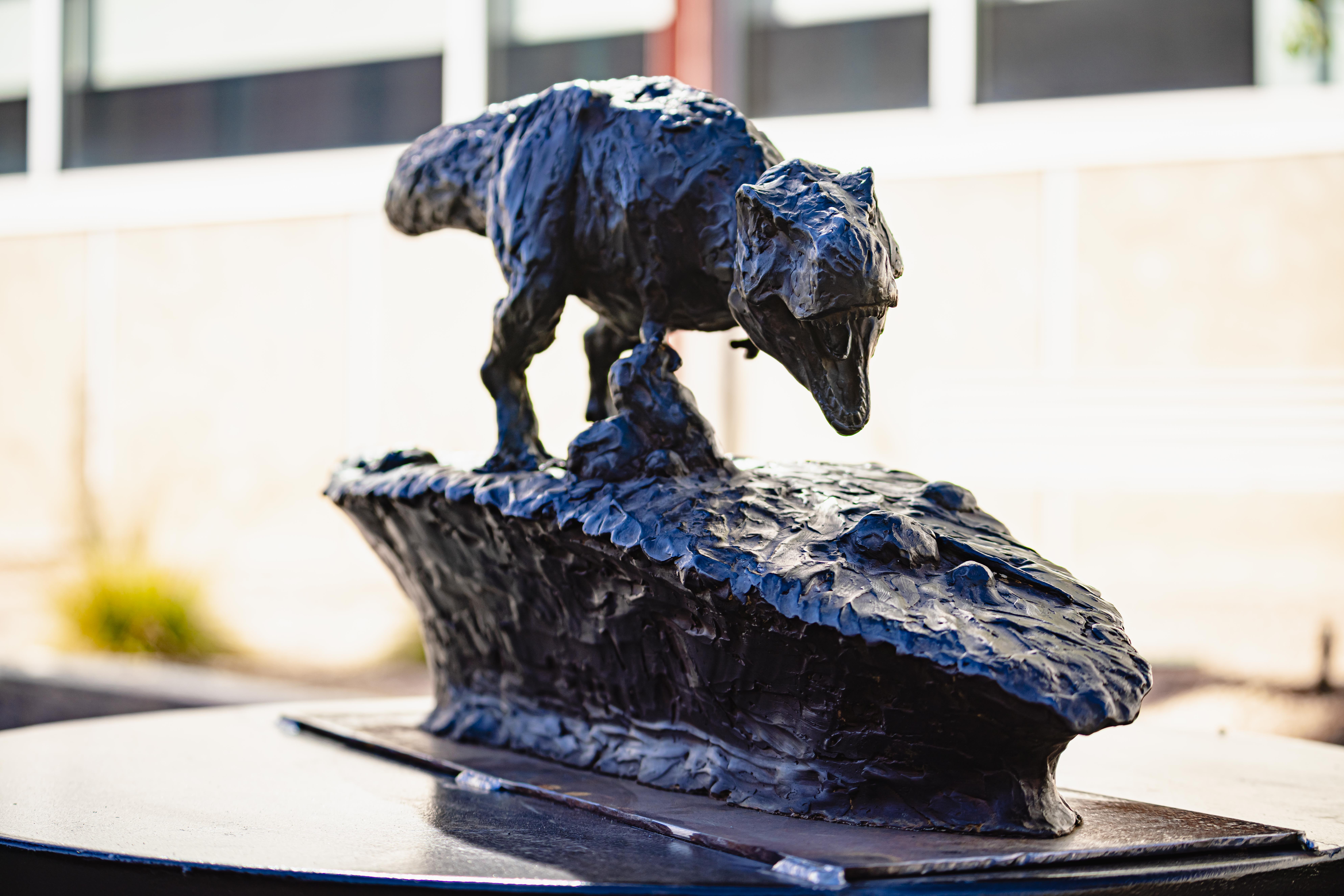 Bronze dinosaur statue