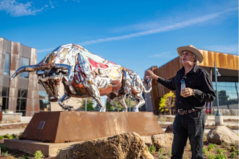 Artist Sean Guerrero speaks at statue unveiling event. 