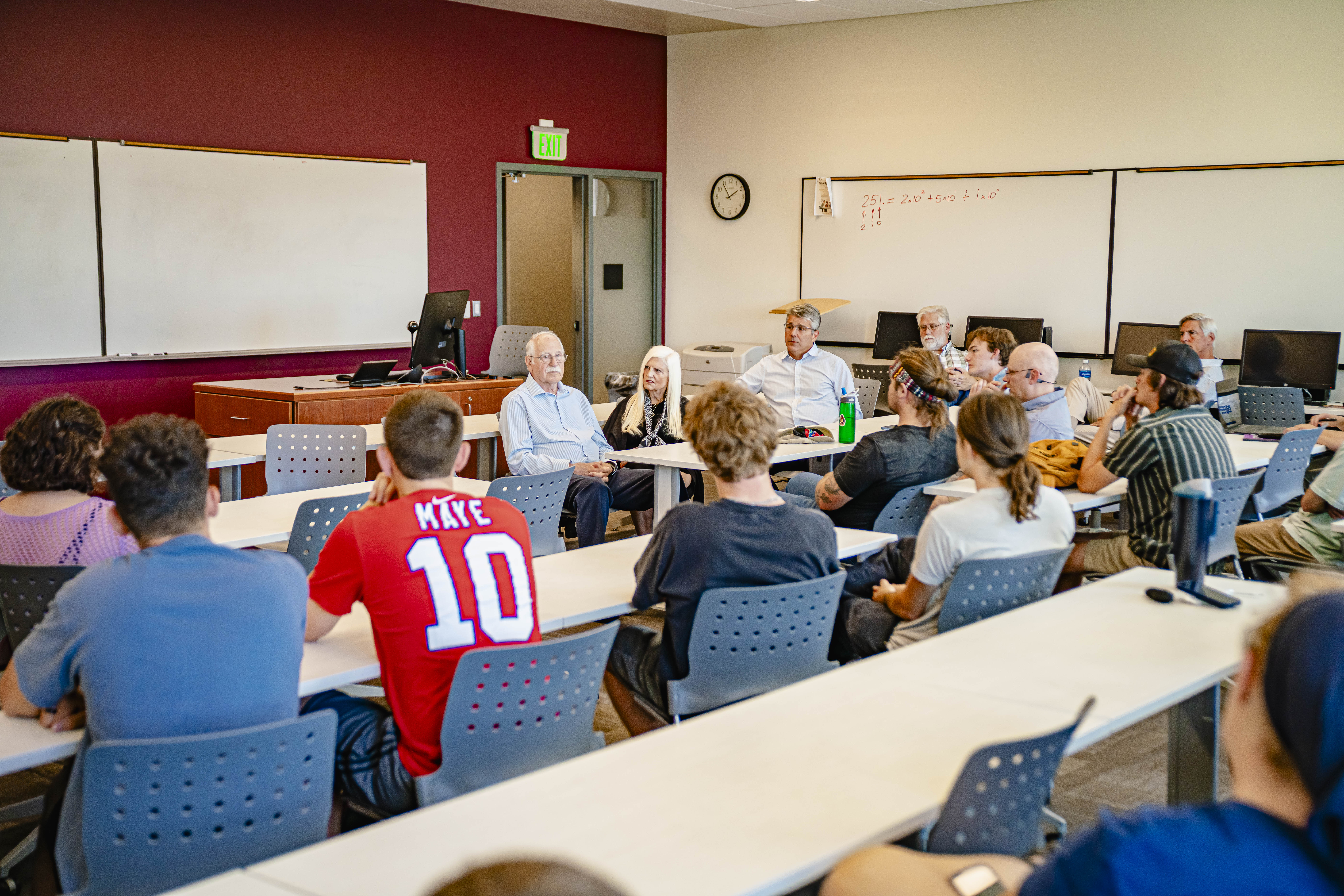 Chuck Hull and his wife, Anntionette, speak with students during the Q&A