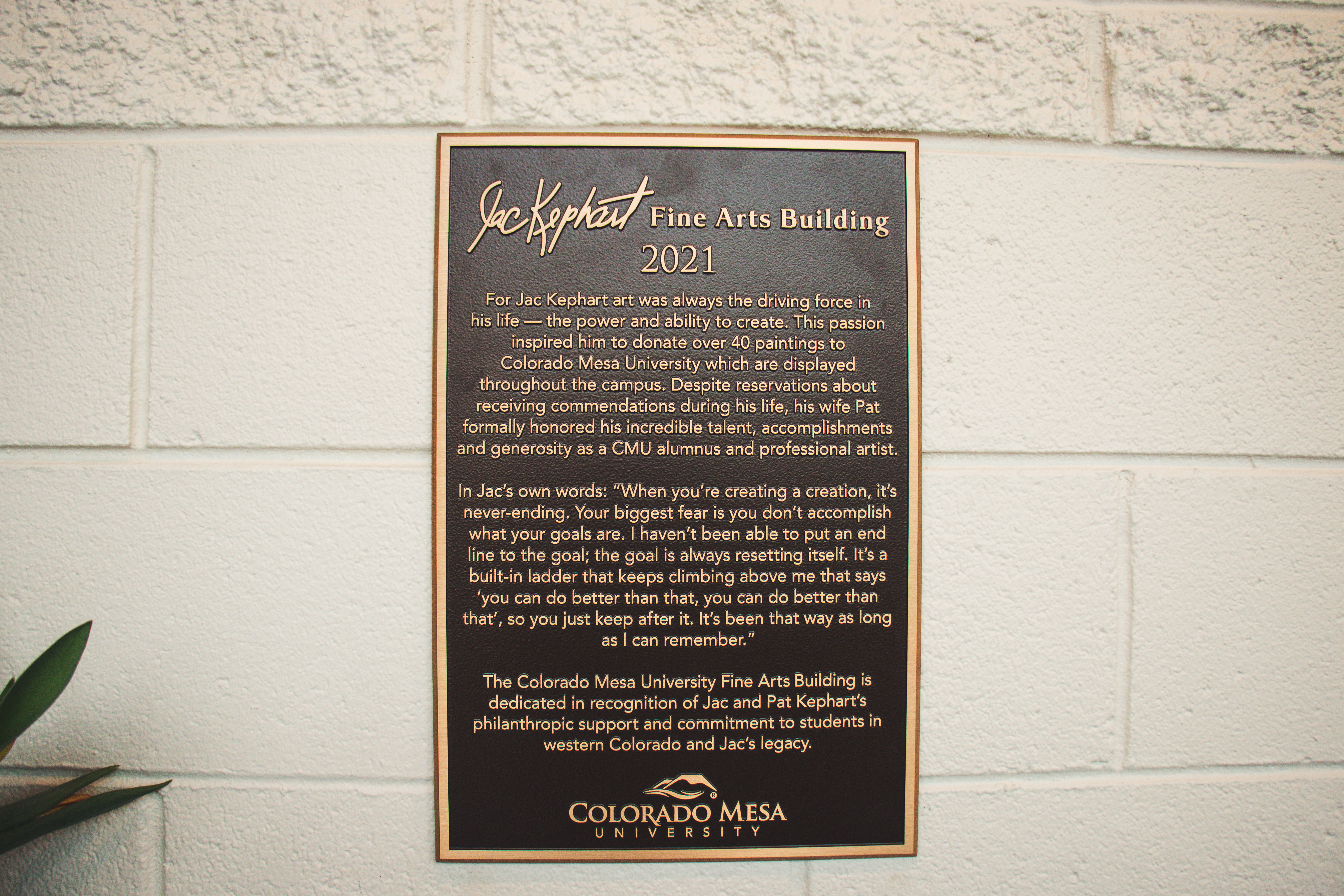 The plaque displayed in the Jac Kephart Fine Arts Building