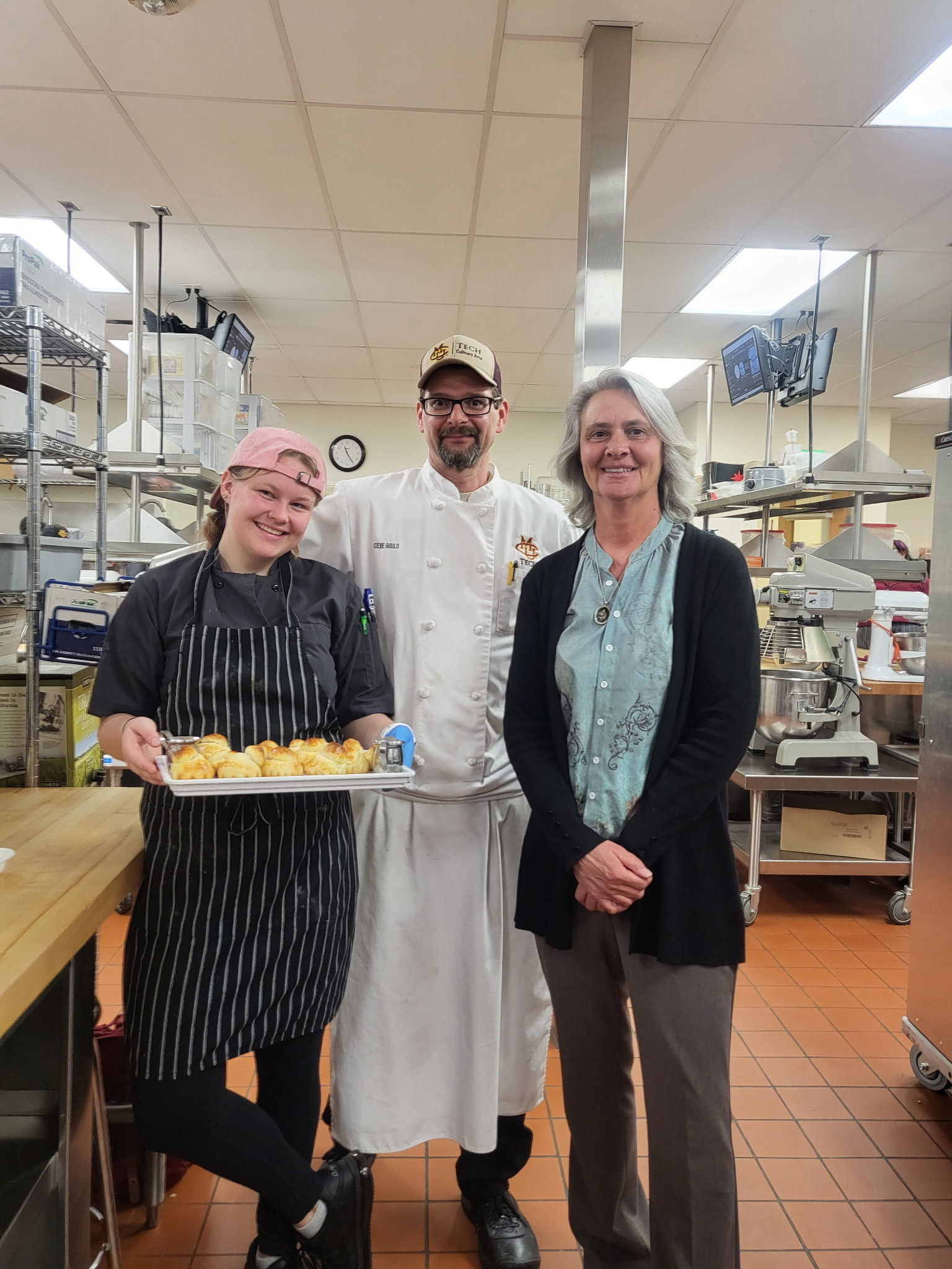 Apprentice showcases finished pastries.
